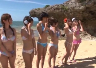 Nasty Japanese babes in bikini get naughty in cute group sex